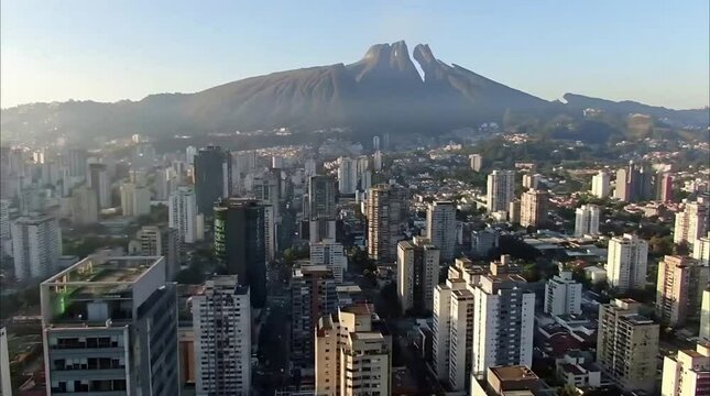 Aerial shot of Caracas with Avila Mountain and modern towers