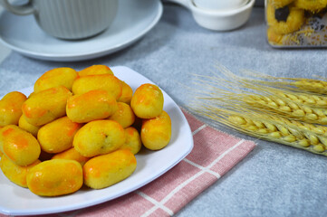 Nastar Cookies, Pineapple tarts or nanas tart are small, bite-size pastries filled or topped with pineapple jam, commonly found when Hari Raya or Eid Al Fitr or Lebaran. Selective focus 

