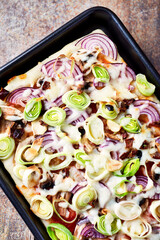 Pizza with mozzarella cheese and leek. Close up.