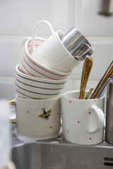 Dirty soapy dishes on the kitchen sink