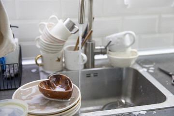 Dirty soapy dishes on the kitchen sink