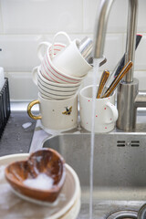 Dirty soapy dishes on the kitchen sink