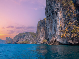 Stunning cliffs and turquoise waters of maya bay island, Thailand at sunset