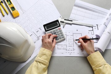 Architect working with project, top view. Different technical drawings and construction tools on...