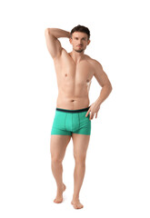 Fototapeta premium Young man in stylish turquoise underwear on white background
