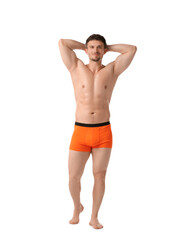 Fototapeta premium Young man in stylish orange underwear on white background