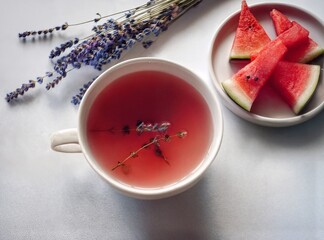 Gen AI Author's tea with unusual ingredients. Glass cup of herbal tea. Lavender, dried watermelon, corn. drip brewing, slow brewing, manual decanting