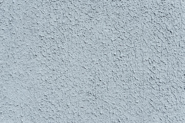 Fototapeta premium Close-up, background texture of a beige-white facade wall of a house made of decorative plaster. Abstract surface.