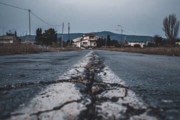 Empty road, distant house