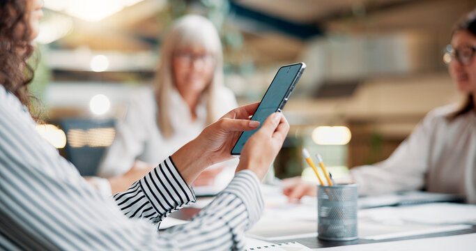 Business, person and hands with phone in meeting for email marketing, SEO tools or digital collaboration with notification. Creative, check website traffic or social media insight with team in office