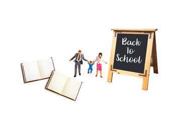 miniature people with blackboard isolated on white background.