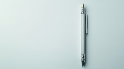 A metallic silver pen on a plain white surface