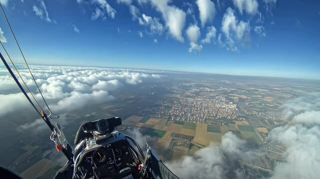 Powered Paraglider Aerial View of City and Sea of Clouds