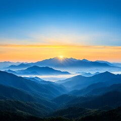 Fototapeta premium Sunrise Over Blue Mountain Range and Misty Valley