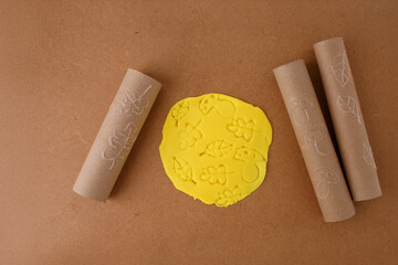innovative clay stamping technique using cardboard tubes with leaf and mushroom patterns, great for...
