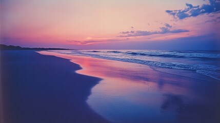 Polaroid of a tranquil beach at sunset, soft pinks and purples in the sky, gentle waves reflecting the warm light