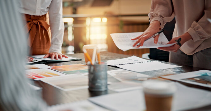 Documents, design team and hands of business people in meeting for project ideas, research and discussion. Creative, office and workers with paperwork for planning, collaboration and brand strategy