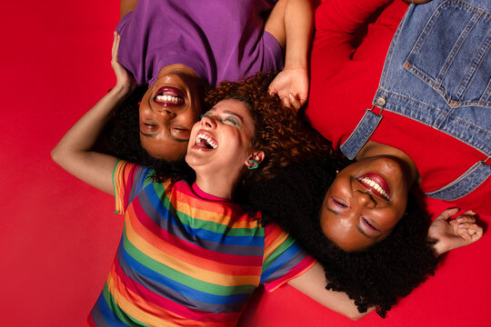 friends embracing joy and unity on vibrant background