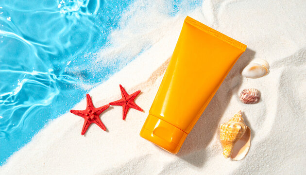 An orange sunscreen container resting on sandy beach with surrounding seashells near turquoise water edge. Perfect imagery conveying summer, skincare, vacation, and sunny beach relaxation themes.