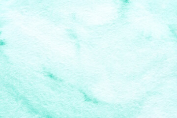 Mint green watercolor background with soft textured patterns for creative design projects.