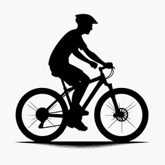 Fototapeta premium Silhouette of a cyclist riding a mountain bike
