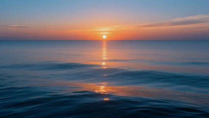 A serene and beautiful ocean sunset captures the warmth of the sun as its reflection dances on the water under a vibrant sky reflecting peace