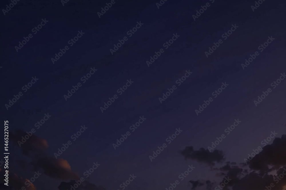 Poster a stunning view of a clear blue sky adorned with fluffy clouds, illuminated by the warm light of the