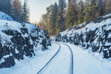 Railway track between the rocks at winter.