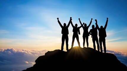 Silhouettes of triumphant people on a mountaintop at sunrise.