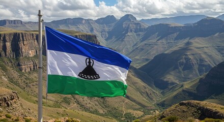Waving Basotho Flag Symbolizing Mountain Kingdom Peace Over the High-Altitude Drakensberg Ranges