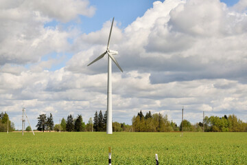 Renewable energy. Wind generator against the blue sky