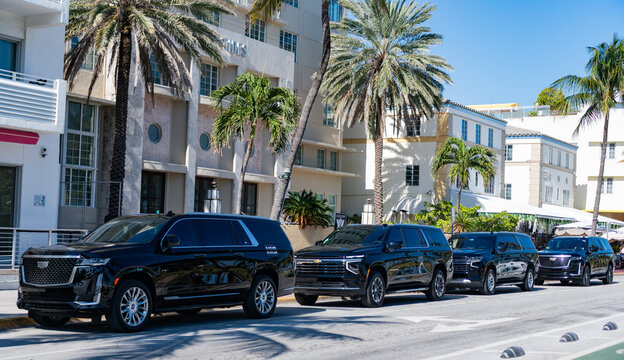 Miami, Florida, USA - December 06, 2024: Cadillac Escalade 2022 SUV car. Luxury SUV car of Cadillac Escalade at building. Car of Cadillac Escalade parked outdoor. Cadillac Escalade, side view