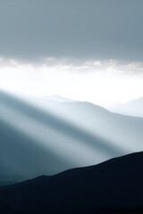 mountain ridge in argentina under dramatic storm clouds showcasing natural symmetry