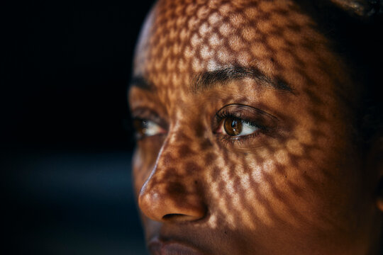 Close-up of sunlight shining on woman's face