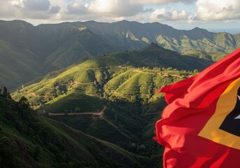 Waving Timorese Flag Symbolizing Independence Against the Rugged Mountainous Interior Landscape