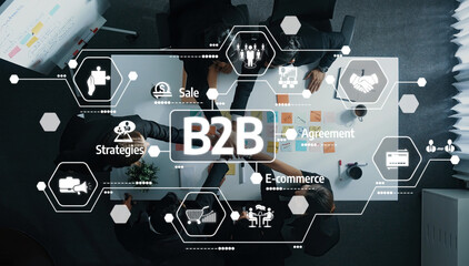 This image showcases a B2B collaboration with diverse professionals at a modern table, emphasizing digital strategies related to sales and e-commerce in a well-organized workspace. Amity