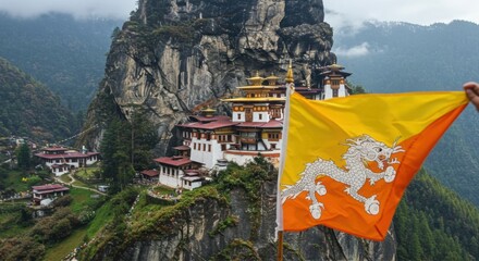 Waving Bhutanese Flag with Druk Dragon Against the Majestic Snow-Capped Peaks of the Himalayas