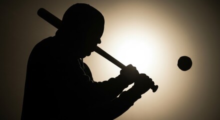 Intense silhouette of a baseball player poised to strike, with dynamic lighting