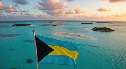 Waving Bahamian Flag Over the Pristine Turquoise Waters and White Sandbars of the Archipelago