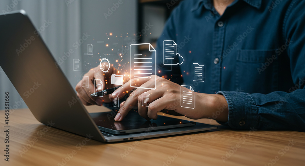 Poster a person using a laptop with digital document icons floating above the screen on a wooden desk space