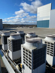 Heat pump condenser units roof mounted for heating and cooling