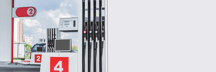 Long Banner, filling station with petrol and diesel hoses.