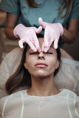 Naklejka premium Woman Receiving Botox Injection at Aesthetic Clinic