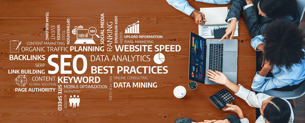 A diverse team collaborates around a table, focusing on data analytics and effective SEO strategies...