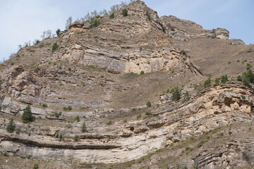 The top of the mountain. A rock formation.