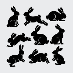 Set of rabbits silhouette in different poses. Hand drawn black silhouettes of easter bunnies isolated on white background.