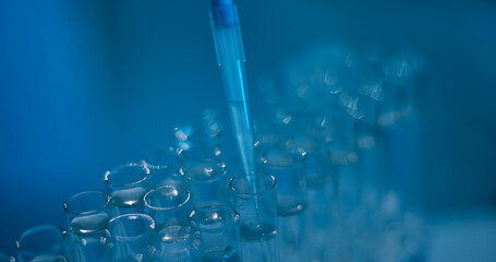 Science, chemical and pipette with test tubes in laboratory for drug screening, enzyme analysis or healthcare research. Medical study, cell culture and formula with closeup of vials for dna sample