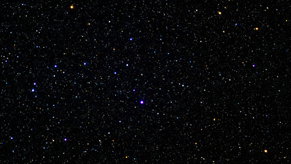 Fototapeta premium Numerous stars sparkle in the night sky, creating a mesmerizing display of celestial beauty. The view captures the vastness of space, with colors ranging from deep blue to bright white