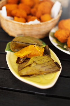 Abar&aacute; on the plate, traditional food from northeast Brazil wrapped in banana leaves, black table and traditional food background