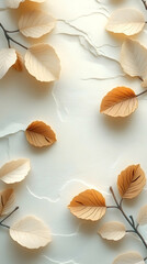 Delicate, autumnal leaves arranged on a textured, light beige background